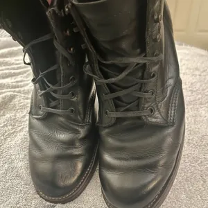 Black Boots with Lace-Up Design