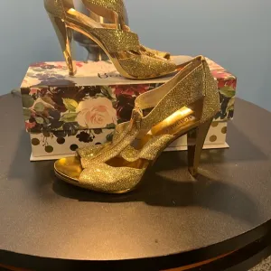 Michael Kors Gold Heels with High Stiletto and Intricate Straps