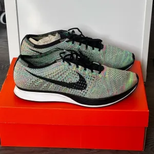 Nike Flyknit Racer Multicolor Running Shoes. Men’s Size 11 Women’s Size 12.5